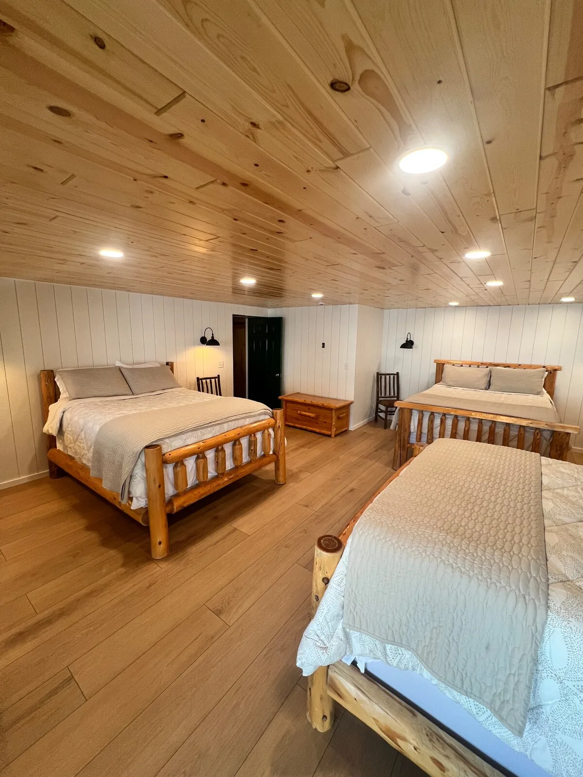 Sandbar Suite alternate angle showing log bed frames and cozy decor