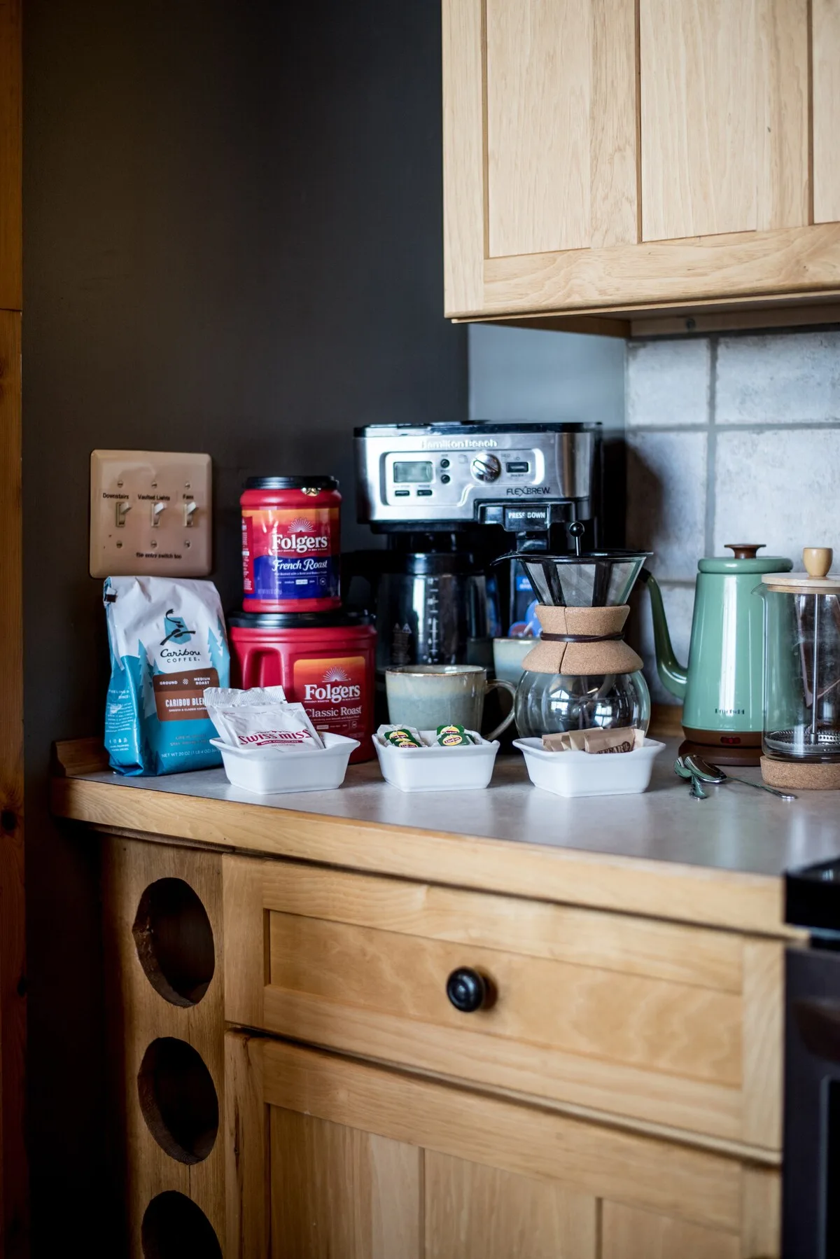 Coffee station with Caribou Coffee, Folgers, pour-over, Keurig, and green kettle
